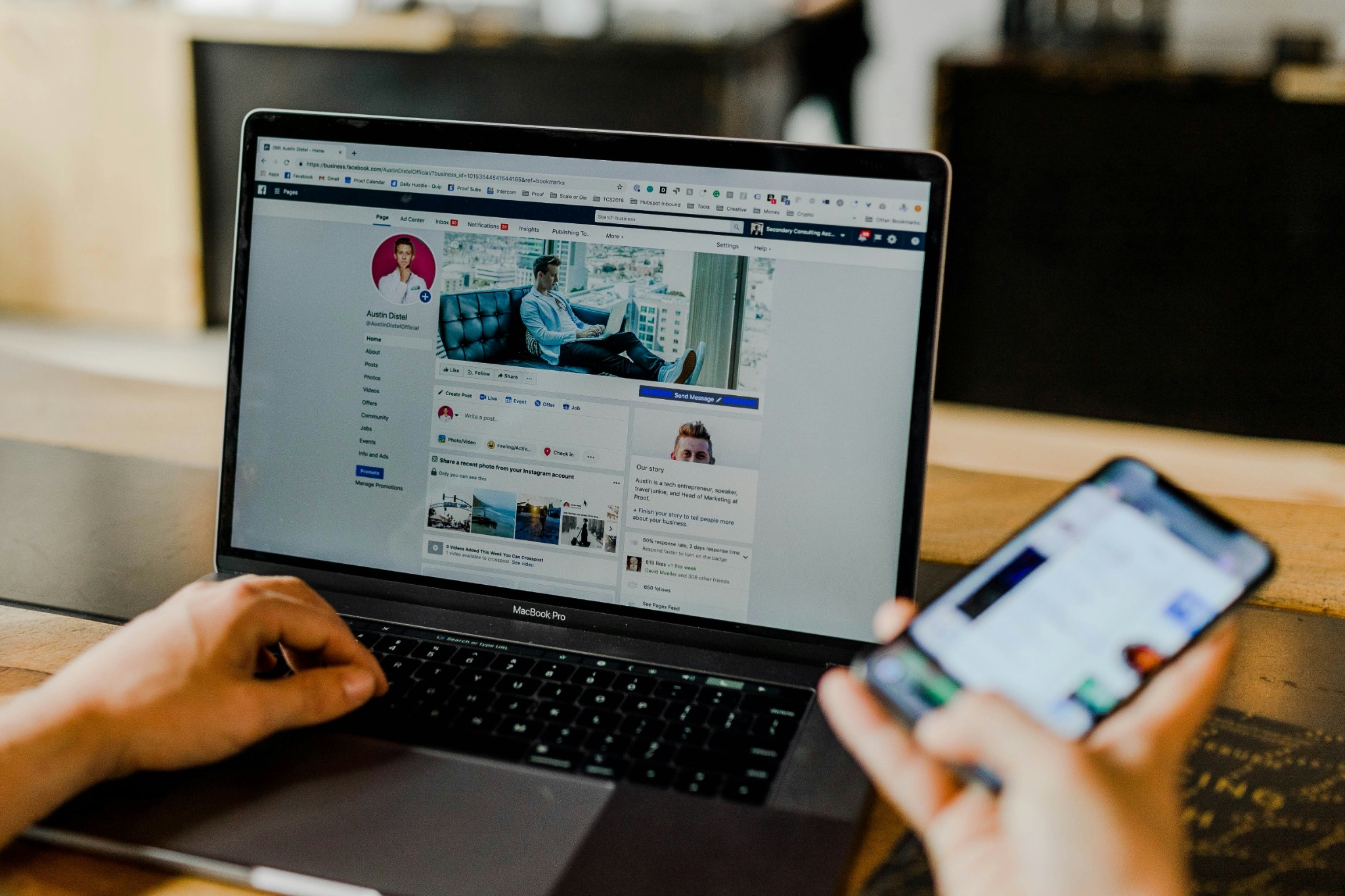 Marketer managing a Facebook business page and advertising campaign on a laptop