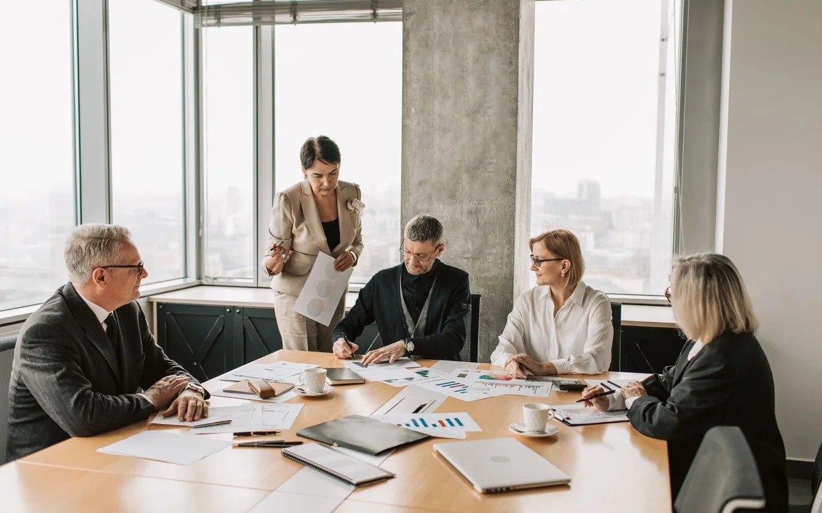 Business partners meeting around a conference table