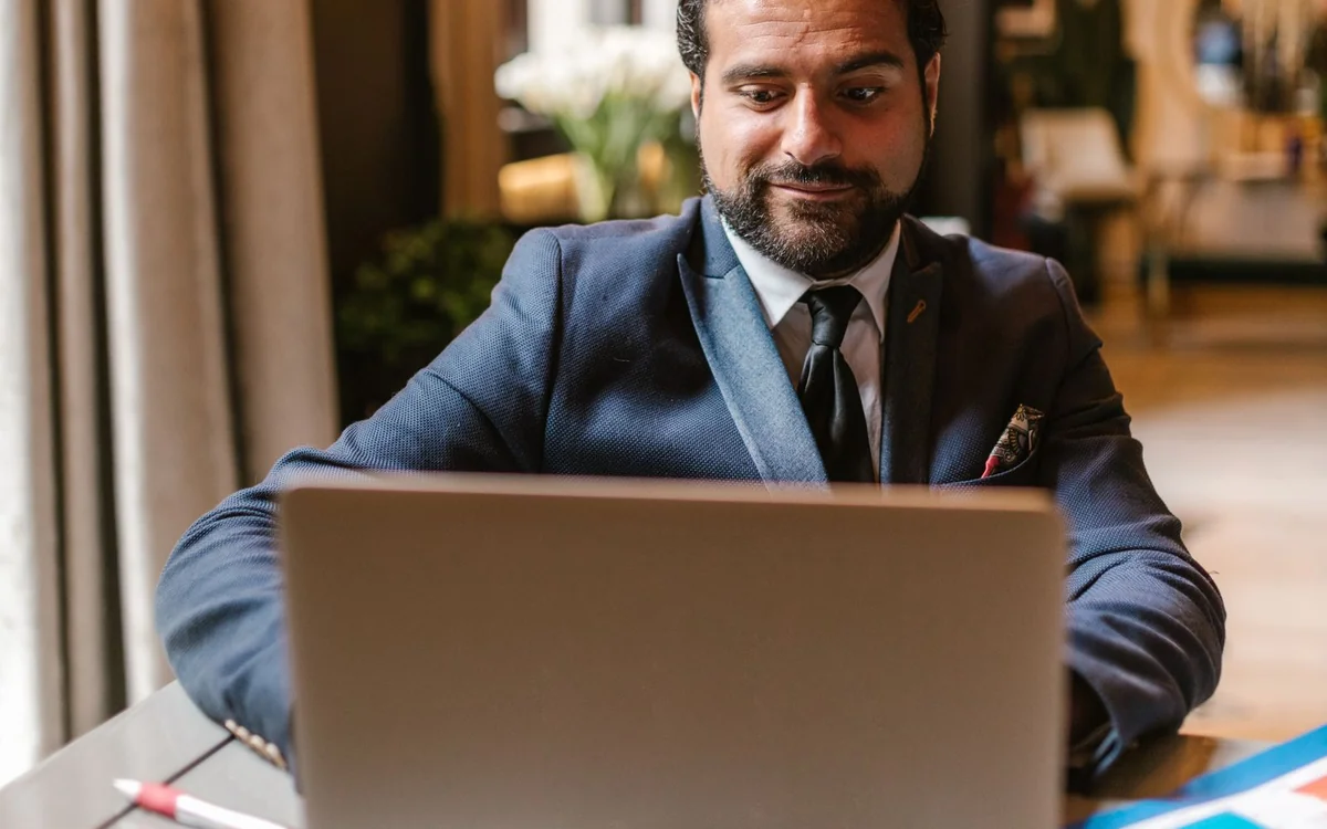 Entrepreneur working on a laptop in a professional workspace