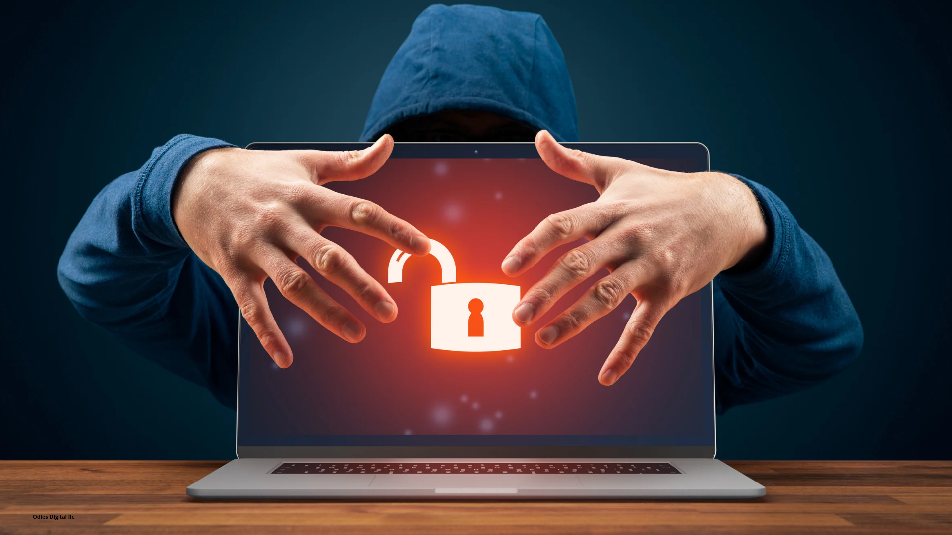 Illustration of a hooded figure behind a laptop displaying an unlocked padlock